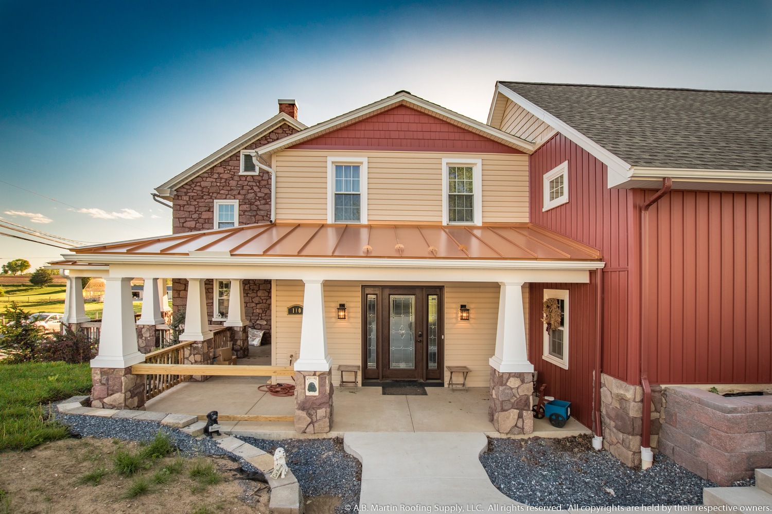 Building Showcase Farmhouse with Copper Penny Porch Roof 